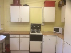 The kitchen at Hever Village Hall, showing storage cupboards